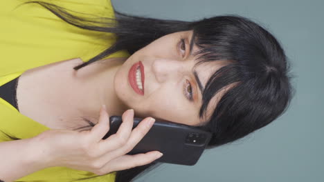 Vertical-video-of-Woman-getting-bad-news-on-the-phone-gets-upset.